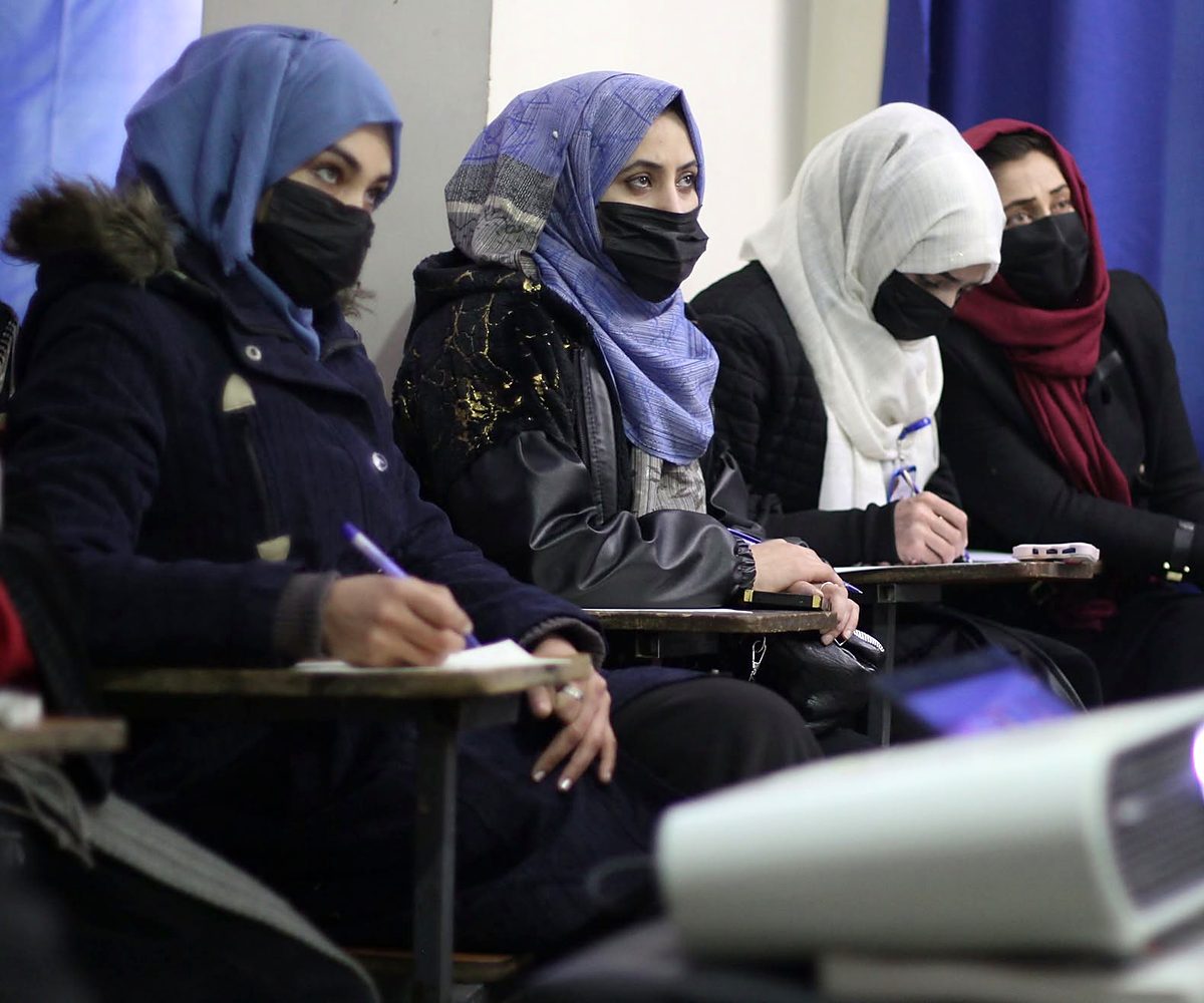Students listening to a presentation in class